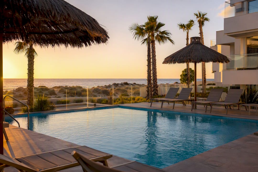 Modern beachfront apartment pool in Les Marines