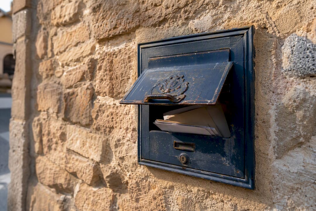 Postal mailbox with missed mail inside